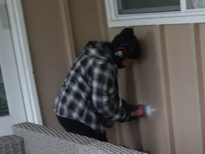 Professional electrician installing an exterior outlet in Greenville