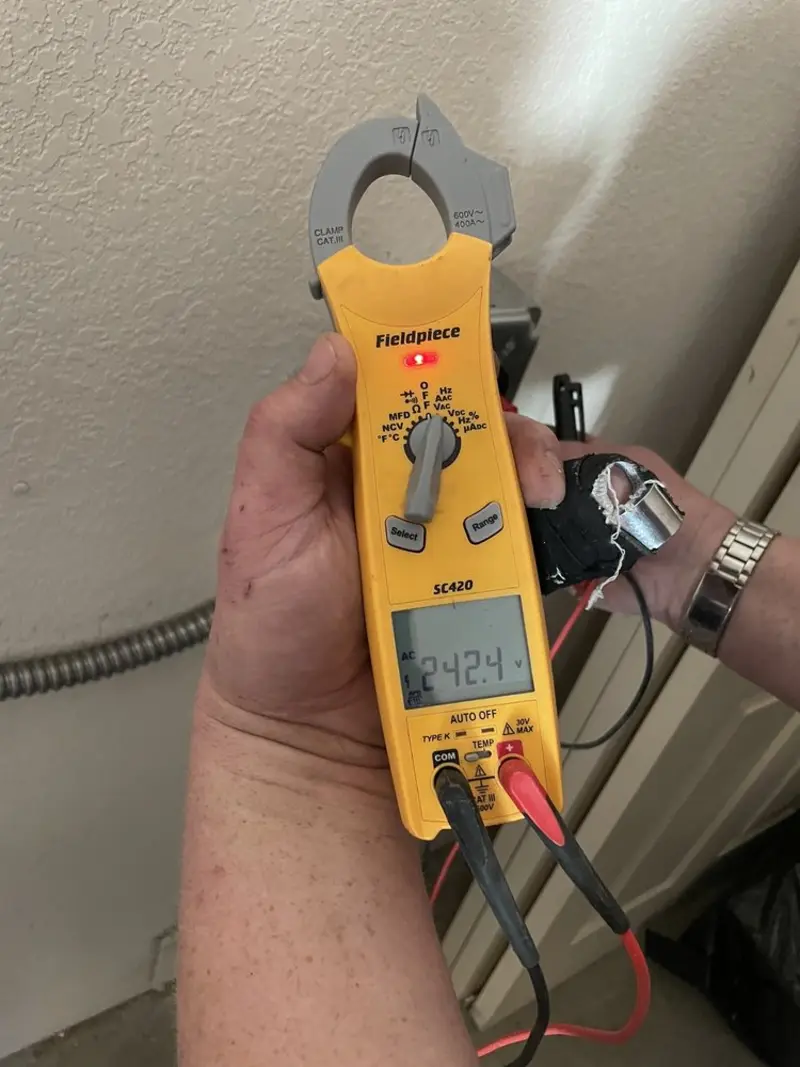 Voltage testing with clamp meter during Outlet Installation in Greenville